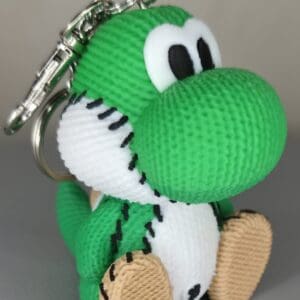 Knitted green dino keychain