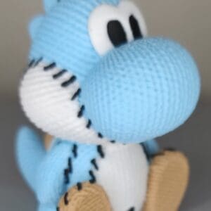 Knitted Ice blue dino keychain