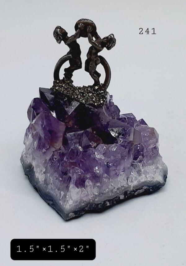 Pewter Figures Pouring Pyrite Stone On Amethyst Crystal