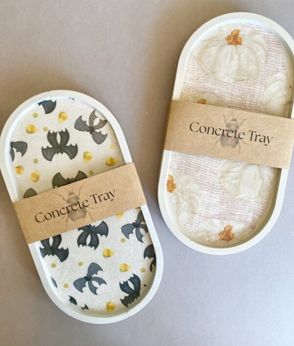 These beautiful concrete trays are a great decor accessory for the fall and halloween holiday, featuring pumpkins, bat bows and candy corn