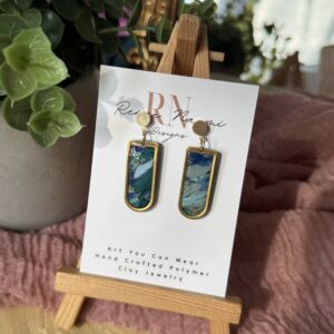 Gold framed blue marbled earrings
