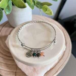 Twist bangle with tree charm and gems